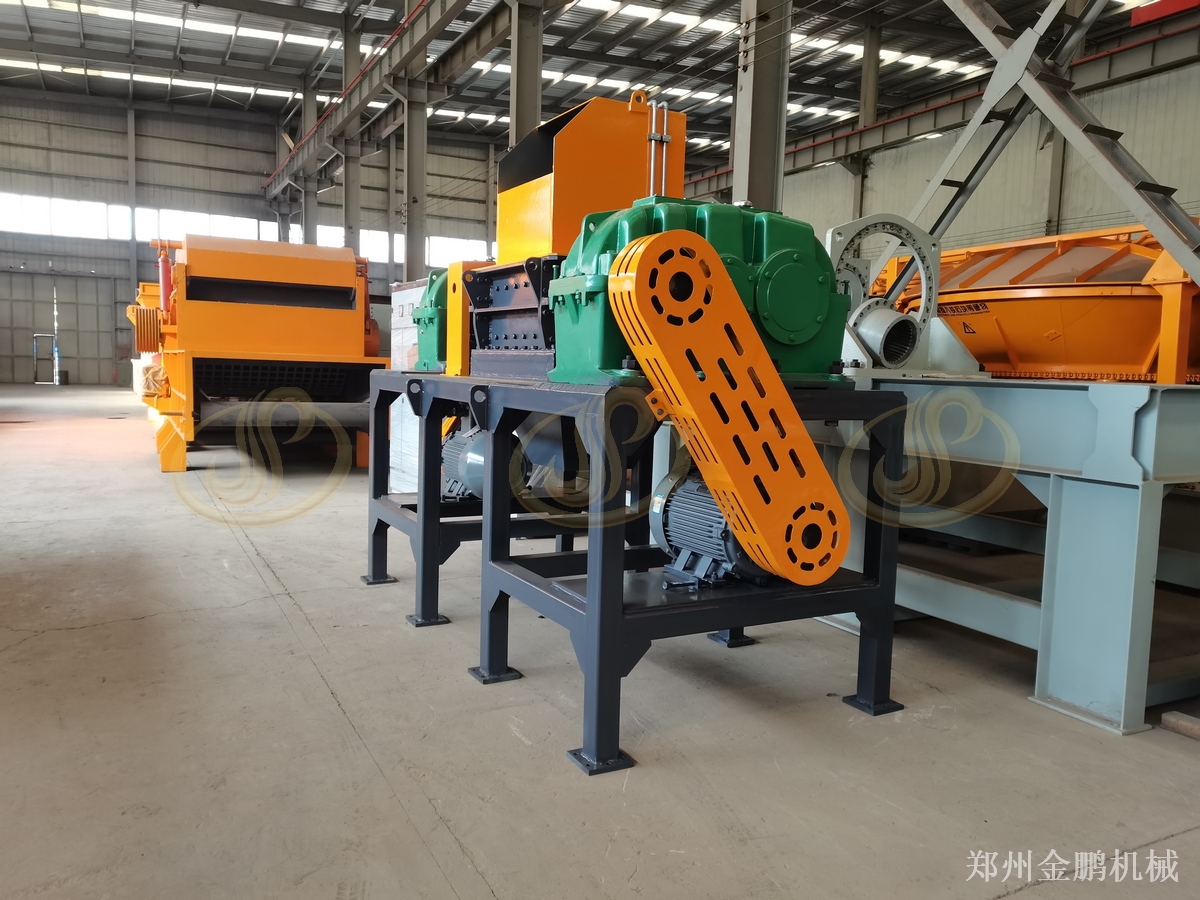 郑州金鹏垃圾中转站撕碎机：压缩转运前撕碎减容处理